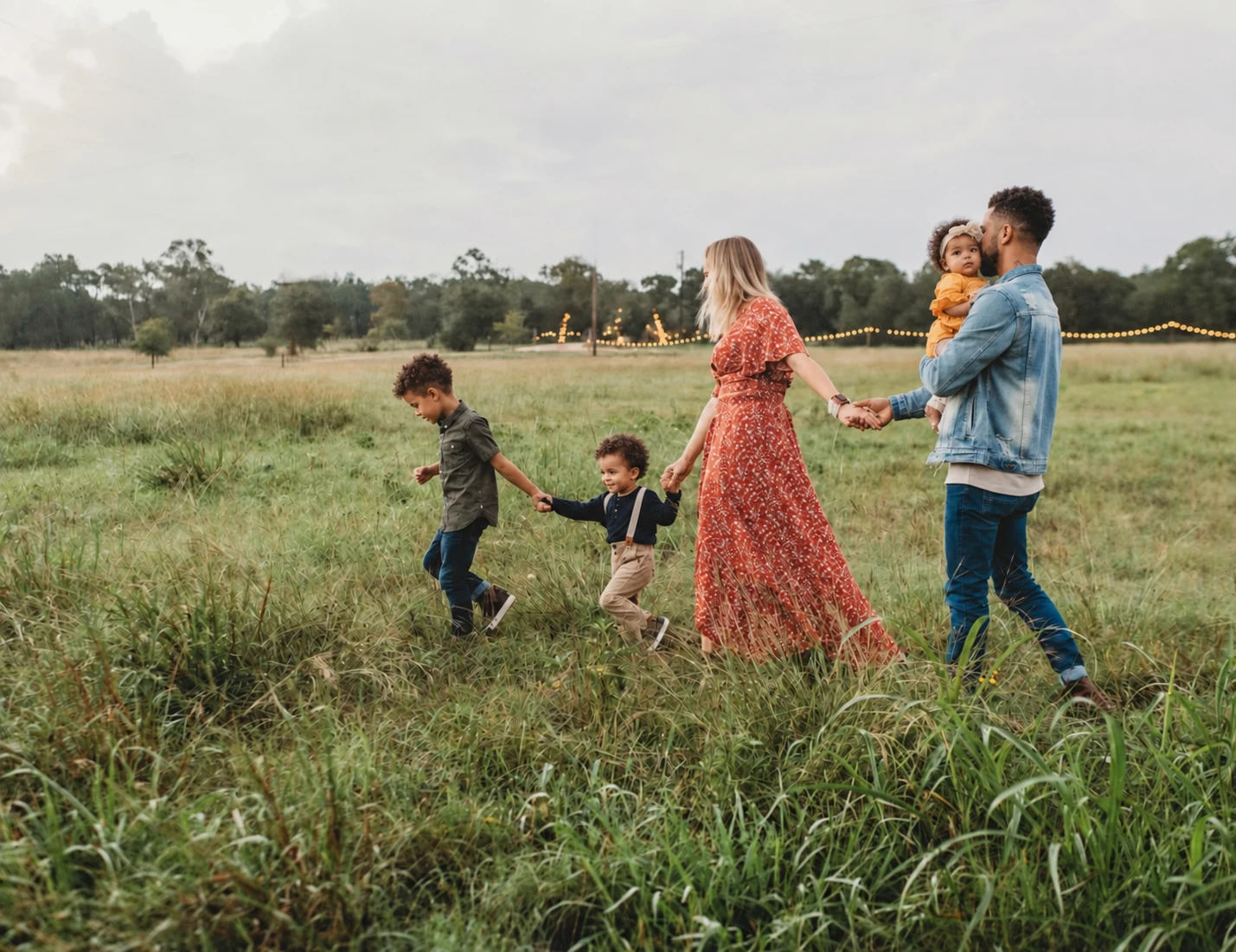 A family walking together through a meadow
