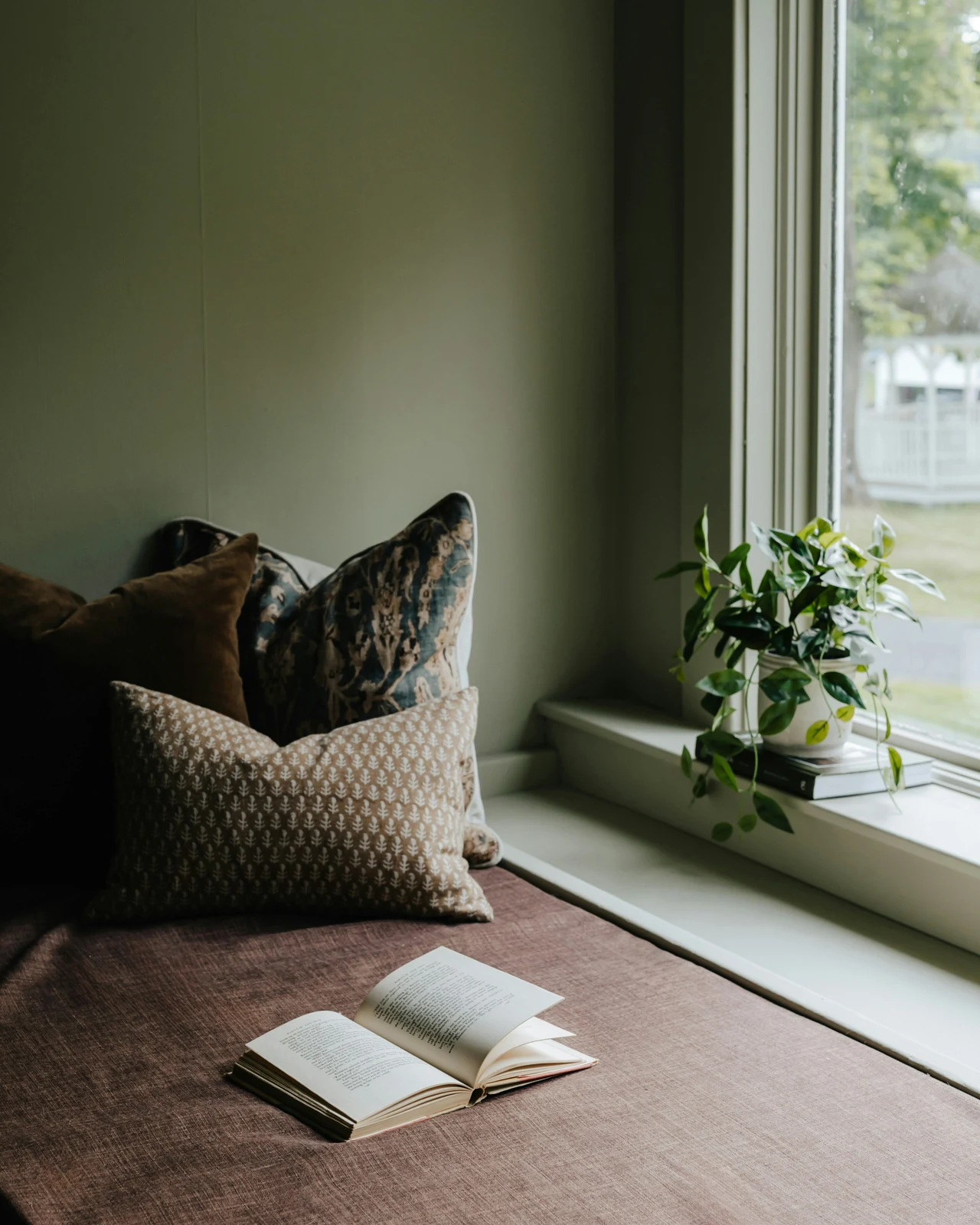 A quiet space with books beside a window